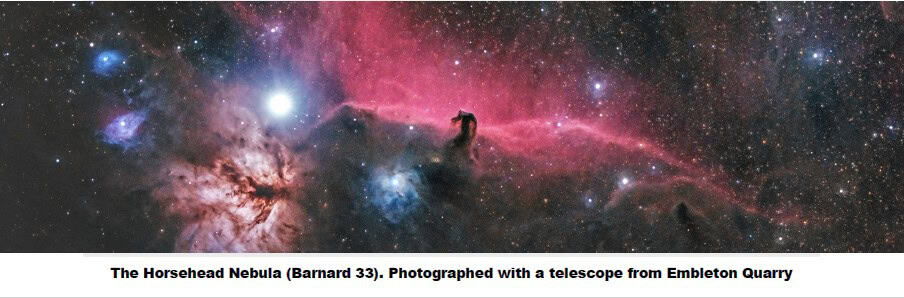 The Horsehead Nebula glows in space, with bright stars and pinkish nebula clouds against a dark sky.
